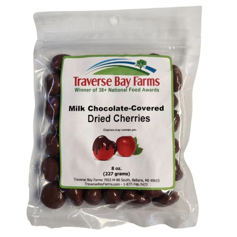Traverse Bay Farms 8 oz bag of milk chocolate covered dried cherries, made with Michigan-grown Montmorency cherries