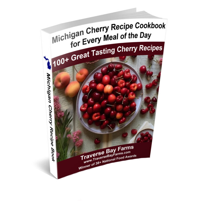 Cover of the Michigan Cherry Recipe Cookbook for Every Meal of the Day, featuring over 100 cherry recipes curated by Traverse Bay Farms
